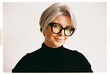 © Viktor Solomin/Stocksy - Stylish older woman with short gray hair and oversized glasses