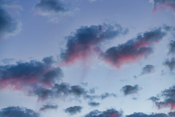 Wall Mural - a beautiful sky tinted by the sun leaving vibrant shades of gold, pink, blue and multicolored. cloud