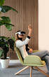 © VICTOR TORRES/Stocksy - Woman Engaging with Virtual Reality Headset in Modern Setting