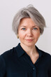 © Viktor Solomin/Stocksy - Confident woman with short gray hair