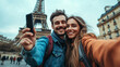 © SB4 GM - Couple taking a selfie in front of a famous landmark