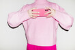 © Colour Laboratory/Stocksy - All pink fashion style outfit and pink mobile phone smartphone