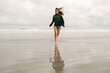 © Lea Jones/Stocksy - happy young woman on beach