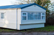 © Dave Wall/Stocksy - A mobile home, waiting to be collected