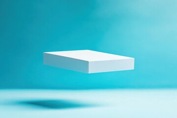 Fototapete - Floating white box on a vibrant blue background showcases modern minimalist design and creative presentation techniques