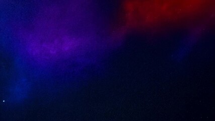 Wall Mural - A vibrant cosmic scene showcasing a colorful nebula in shades of purple, pink, orange, and yellow.