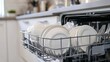 © Ilona - A well-organized kitchen showcases a dishwasher with clean, white plates, cutlery, and cups neatly arranged in drying racks. Sunlight brightens the space