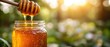 © EchoFrame - Golden honey dripping from wooden dipper into glass jar against blurred green foliage background, natural light and warm tones create a sweet and inviting scene