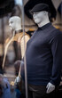 © Samir - Male mannequins displayed in a fashion store window, wearing casual clothing including a cap and polo shirt, showcasing plus-size menswear.