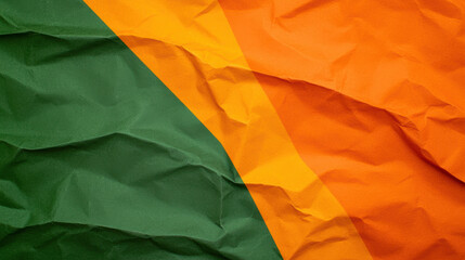 Wall Mural - crumpled paper texture featuring green and orange colors, creating vibrant and dynamic visual effect