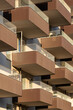 © yaqui_villegas - Geometric pattern of stacked balconies on modern apartments in Bryggen, Copenhagen, with soft shadow and clean structure. Ideal for real estate, housing or urban planning visuals.