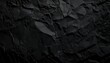 © Kristina - A textured, crumpled black paper background with a modern, abstract aesthetic