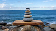 © Rsquare stock - Concept of Harmony and Balance – Stacked Stones Against the Sea, Tranquil Nature and Mindfulness Visualization