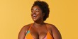 © Iryna - A woman with a big bust is smiling and wearing a colorful bikini. Concept of confidence and happiness