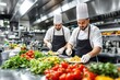 © peshkova - Professional chefs preparing pasta dishes in a modern restaurant kitchen.