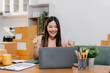 © NINENII - small business entrepreneur SME or freelance asian woman working with box at home.