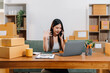 © NINENII - small business entrepreneur SME or freelance asian woman working with box at home.