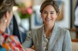 © Frame Haven - Happy mid aged business woman manager handshaking at office meeting. Smiling female hr hiring recruit at job interview, bank or insurance agent, lawyer making contract deal with client at