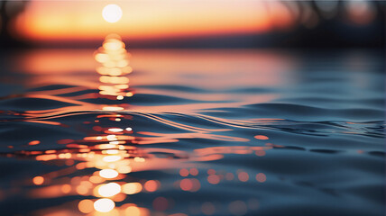 Poster - Golden sunset light reflects on the water, creating a beautiful bokeh effect. Gentle ripples on the water surface evoke a peaceful and dreamy atmosphere.