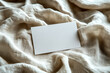 © Stella - Blank business card on textured creamy fabric background,   mockup for design
