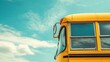 © Marina - Vintage yellow school bus against clear blue sky. Banner's layout with a place for copying.