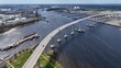 © Steve - Cars crossing Elizabeth river at Norfolk Naval Shipyard in Portsmouth, Virginia showing industrial factories and other industries by the river with public park