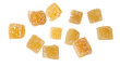 © BarTa - Candied ginger pieces with sugar flying falling isolated on white background.