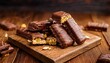 © Mia - mykolaiv ukraine january 14 2021 snickers chocolate bars on brown wooden background