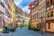 © Aliaksandr - Old town Nuremberg city historical center, pedestrian street Tanner's Lane Weißgerbergasse with old medieval buildings colorful half-timbered houses, Middle Franconia region, Bavaria state, Germany