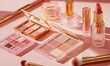 © tania_wild - Beauty still life with cosmetic items in soft pink and gold tones,