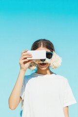 Poster - Playful Gen Z Tech Moment Minimalist White Smartphone Creativity with Quirky Ear Muffs - Digital Native Expression and Trendsetting Visual Content