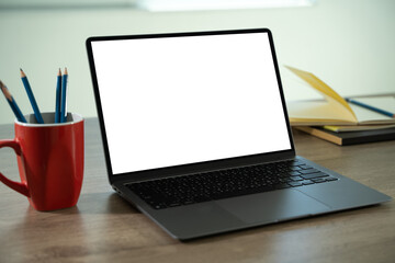Wall Mural - laptop with blank screen on table. workspace background new project on laptop computer with blank co