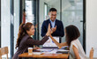 © David - Business handshake for teamwork of business merger and acquisition,successful negotiate,hand shake,two businessman shake hand with partner to celebration partnership and business deal concept
