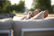 © Antonioguillem - Relaxed man sitting in an exterior sofa in a terrace