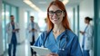 © Gayan - Smiling Nurse Holding Tablet In Hospital
