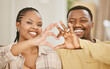 © Siphosethu Fanti/peopleimages.com - Heart, hands and couple with portrait in home for romance, affection and commitment in marriage with smile. African people, emoji and love gesture in living room for caring and trust in relationship