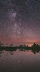 Wall Mural - Sunset And Moon Rising Above Landscape With Lake Swamp Bog Marsh Wetland Nature At Night Light. TimeLapse Time-Lapse Starry Sky Milky Way Galaxy With Glowing Stars. Starlight Reflections In Water