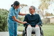 © peopleimages.com - Nurse, garden and senior man in wheelchair with a disability in retirement community park for fresh air. Female caregiver, elderly person and outdoor together with support for assisted living or care