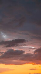 Wall Mural - Sunset Cloudy Sky With Fluffy Clouds. Sunset Sky Natural Background. Dramatic Sky. Sunset Time Lapse Time-Lapse In Yellow, Orange, Pink Colors. Day To Night Transition. Cloudy Sky With Fluffy Clouds