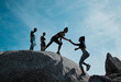 © Courtney/peopleimages.com - Friends, helping and support on rock for fitness, exercise and adventure or group outdoor. Balance, stability and teamwork or women in nature for workout, training and together with trust in morning