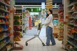 © Serhii - A portrait of pregnant woman customer walking along supermarket.