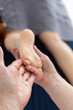 © Victoria - Massage for children's feet. female hands doing massage of feet child