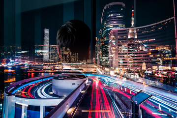 Aufkleber - Double exposure artfully merges a person's silhouette with Hong Kong's vibrant night cityscape. Modern architecture and traffic light trails create a dynamic urban scene.