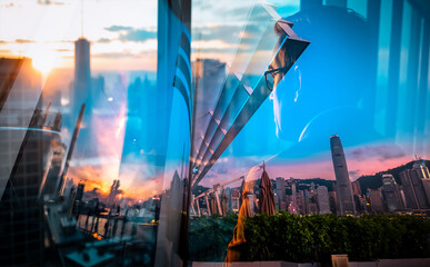 Aufkleber - Hong Kong urban scene with a double exposure effect at sunset. City buildings and sky are visually layered, creating an abstract and dynamic view.