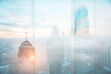 Poster - Woman gazes at Hong Kong cityscape, seen through a window with double exposure effect. Layered buildings create a dreamy urban view, blending indoor and outdoor spaces.