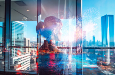 Poster - Double exposure image showcasing a woman looking at the Hong Kong cityscape with bright fireworks overlay. An urban view seen from inside a modern building.