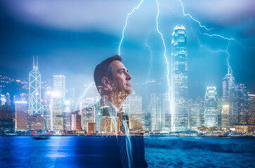 Aufkleber - Double exposure image features a man looking upwards, overlaid with a vibrant Hong Kong cityscape at night illuminated by bright lightning bolts.