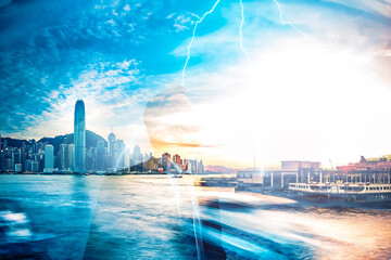 Poster - Hong Kong cityscape with Victoria Harbour in double exposure. Skyscrapers and water blend with a bright sky, creating a unique urban and natural scene.