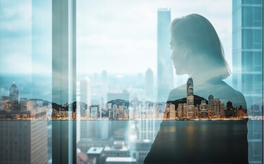 Poster - A woman's silhouette merges with a Hong Kong cityscape in double exposure. Urban skyline and modern architecture blend in a dreamy, layered visual.