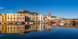 Bosa, Sardinia, Italy - View over the river Temo to the Ponte Vecchio bridge and the historic old town of Bosa with the castle of Serravalle in the background.